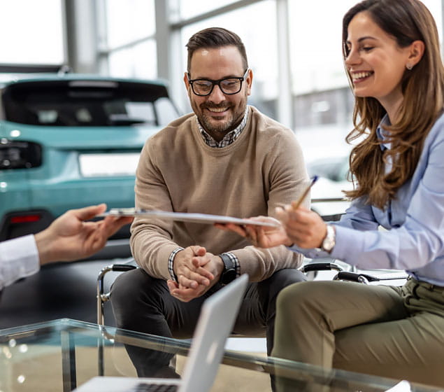 Couple at a Car Dealership Buying a Car