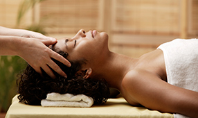 Woman enjoying a scalp massage