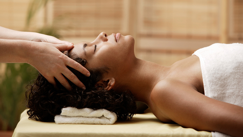 Woman enjoying a scalp massage