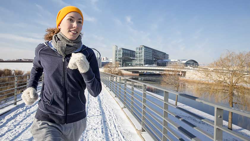 How to Stick With Your Fitness Routine - Woman Jogging in Winter