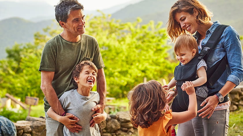 Family of Five Smiling and Laughing