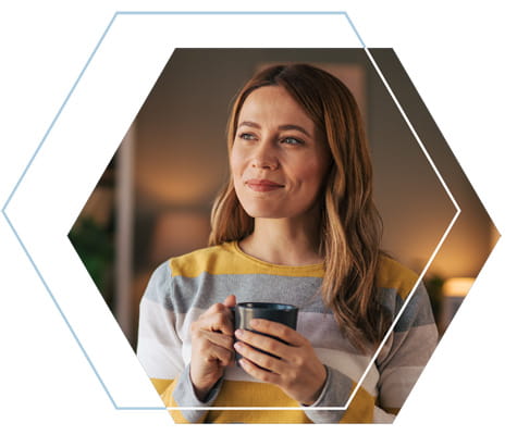 Young Woman Holding a Cup of Coffee