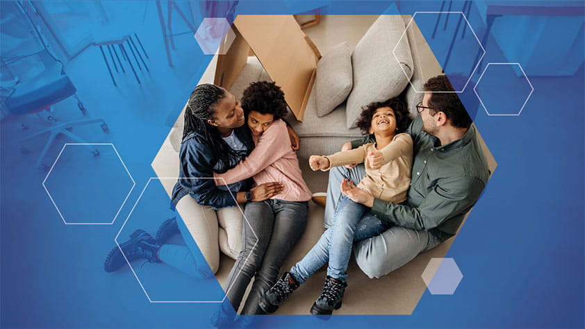 The NEA Life Insurance Guide for Parents: Image looking from above at a family of four having fun at home