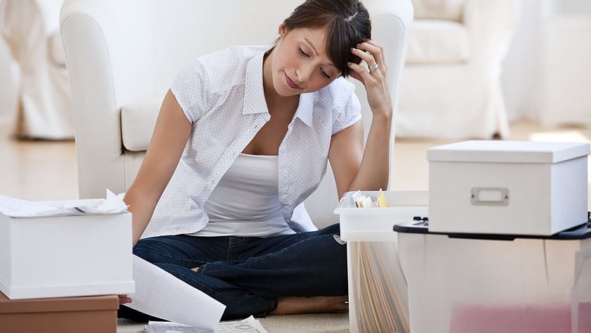 A Guide to Keeping Financial Records - Woman Organizing Financial Papers