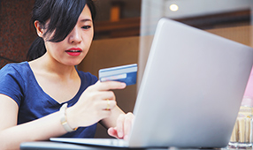 Female Adding Credit Card Number to Online Payment