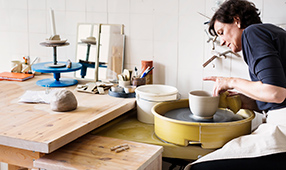 Woman in Her Pottery Studio Making a Bowl