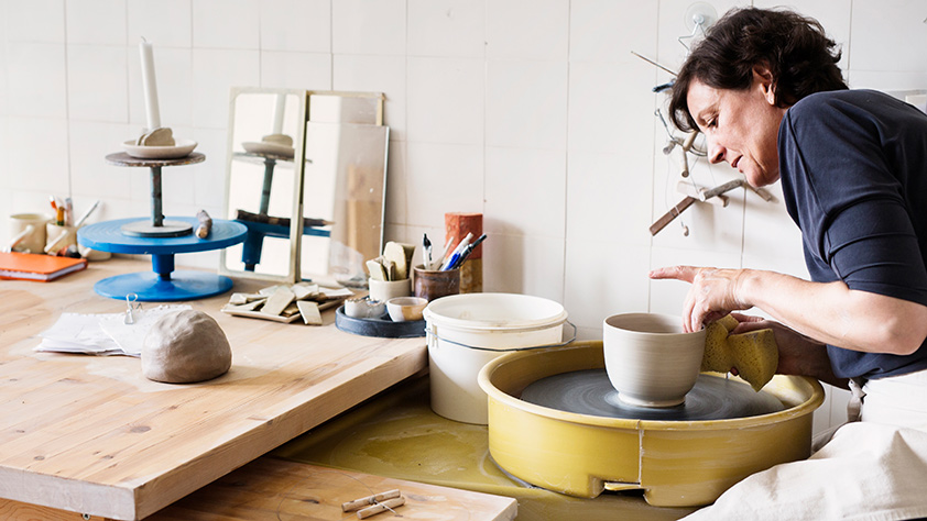 Woman in Her Pottery Studio Making a Bowl
