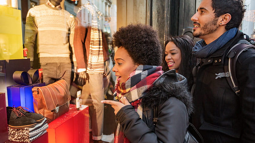 Friends in City Window Shopping During the Holidays