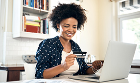 Woman Adding Credit Card to Online Payment