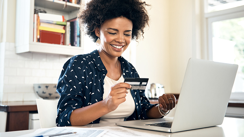Woman Adding Credit Card to Online Payment