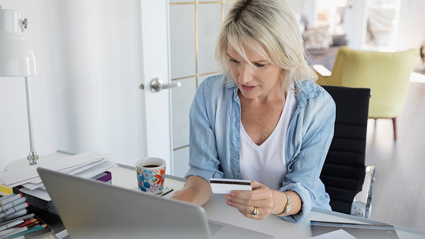 Woman Using Laptop in Home Office