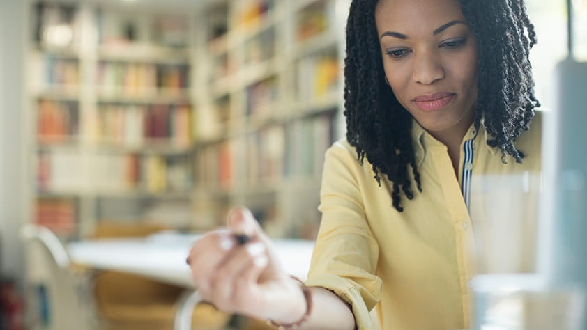 Close Up of Woman Holding Pen