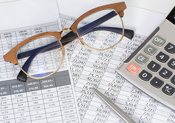 Eye Glasses on Top of Financial Statements