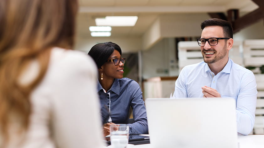Caucasian Man and African American Woman at Business Meeting