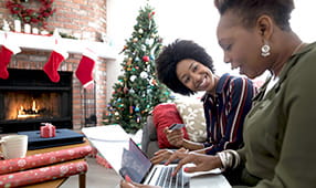Daughter Teaching Mother Laptop on Christmas Day