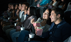 Close Couple Enjoying Movie at Theater
