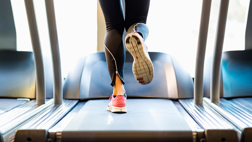 Close Up of Female Legs on Treadmill