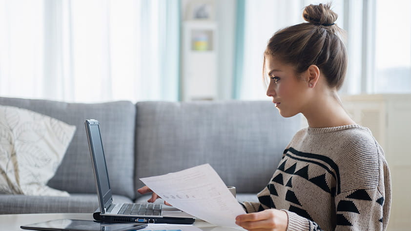 Female in Twenties Reviewing Finances Online