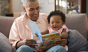 Grandparent Reading Book to Child
