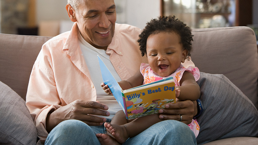 Grandparent Reading Book to Child