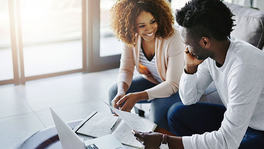Young African American Couple Reviewing Finances