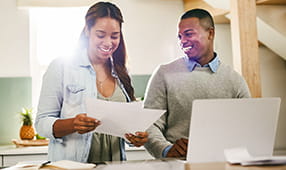 African American Couple Reviewing Paperwork
