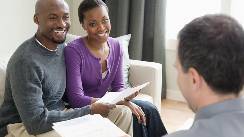 Professional Couple Listening to Financial Overview