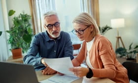 couple going over bills at home