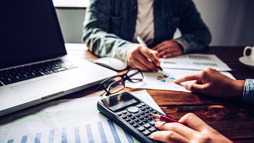 Close-up of a calculator and financial documents