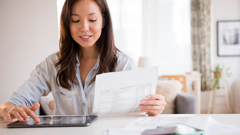 Woman doing work on a tablet
