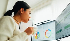 Woman at home working on standing desk
