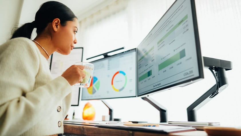 Woman at home working on standing desk