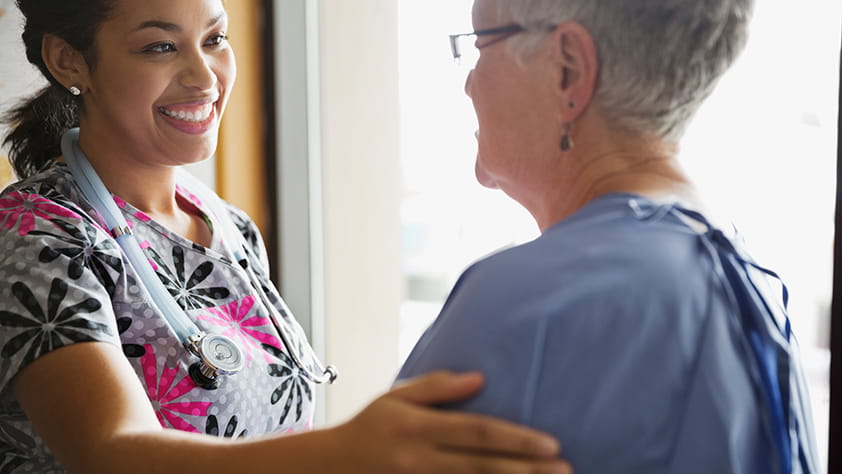 Woman Caring for an Older Patient