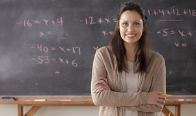 Portrait of a Teacher in Front of a Blackboard