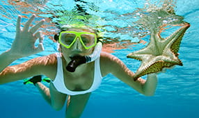 Woman Snorkeling In Ocean