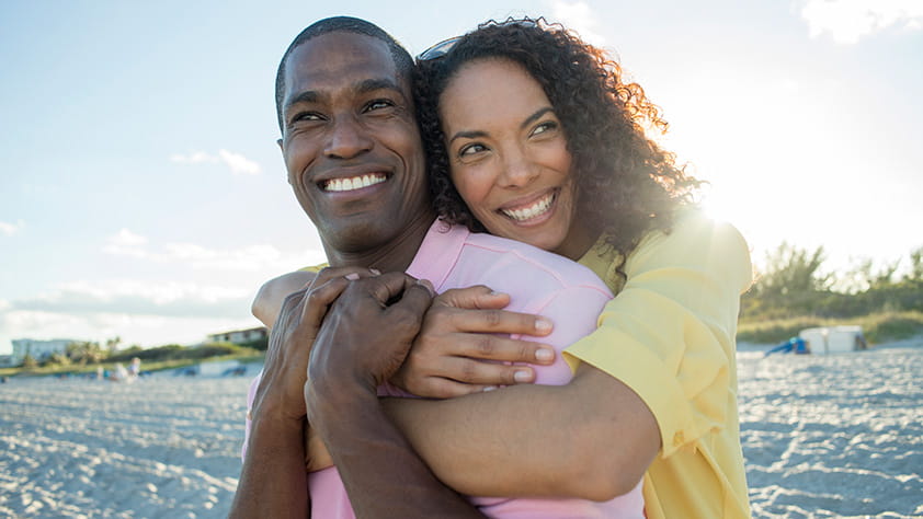Couple Embracing On Beach