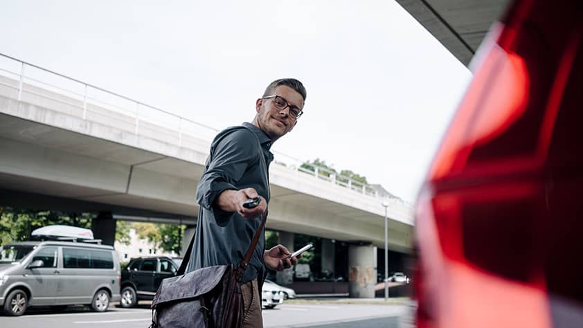 Man Setting Car Alarm on Car
