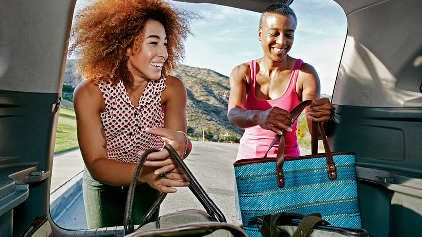 Couple Packing Their Car - Family-Friendly Road Trips