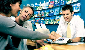 Couple talking to a travel agent