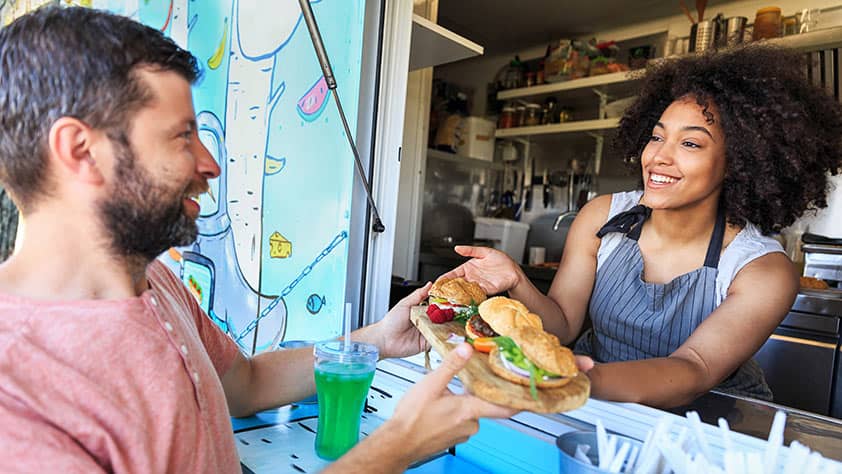 Man Purchasing Food at Food Truck