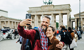 Couple Taking A Selfie Together on Front of Brandenburg Gate in Berlin