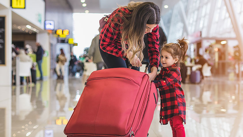 How To Plan a Hassle-Free Holiday Vacation - Mother and Daughter at the Airport