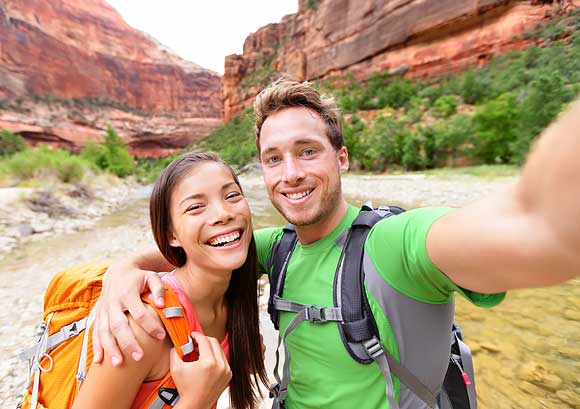 Happy Couple Taking a Selfie While Hiking
