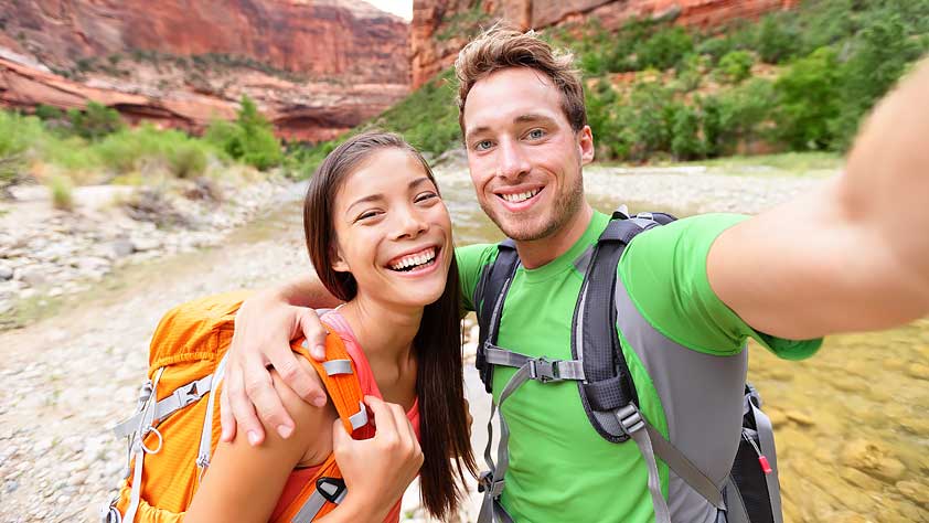 Happy Couple Taking a Selfie While Hiking