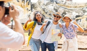 Smiling NEA members enjoying a guided tour in Asia with NEA Travel Program discounts