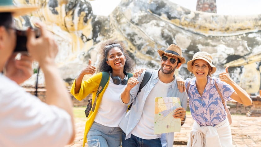 Smiling NEA members enjoying a guided tour in Asia with NEA Travel Program discounts