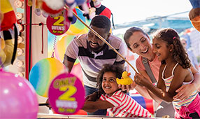 A family enjoying a day out at the fair in Newcastle upon Tyne, North East England.