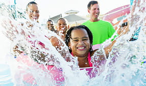 Girl Having Fun at Water Park with Family and Friends