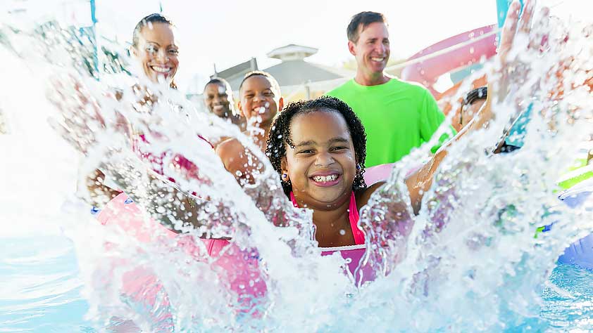 Girl Having Fun at Water Park with Family and Friends