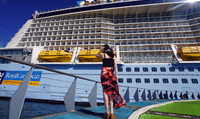 Woman Looking at a Cruise Ship 